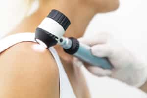 Skin cancer screening exam being performed by a dermatologist in Spicewood